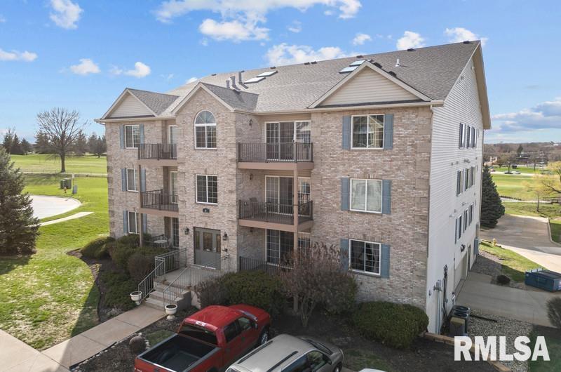 view of property featuring central AC unit