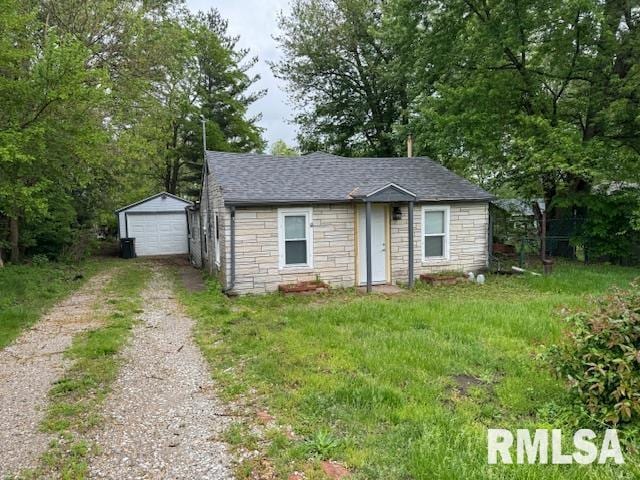 view of outbuilding featuring a garage and a lawn