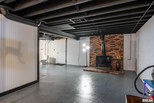 basement featuring a wood stove