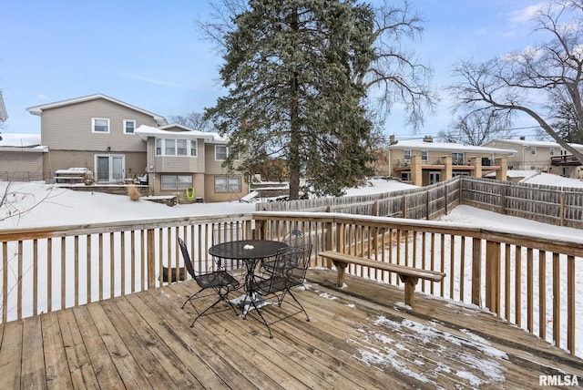 view of snow covered deck