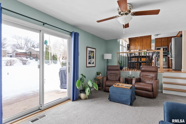 living area with ceiling fan