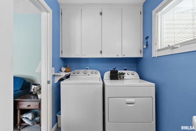 laundry room featuring cabinets and independent washer and dryer