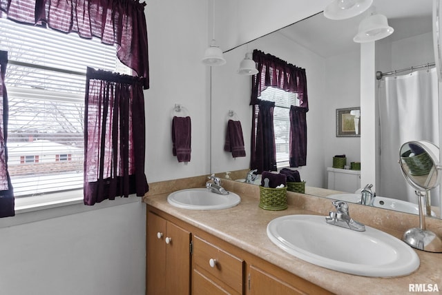 bathroom with vanity and walk in shower