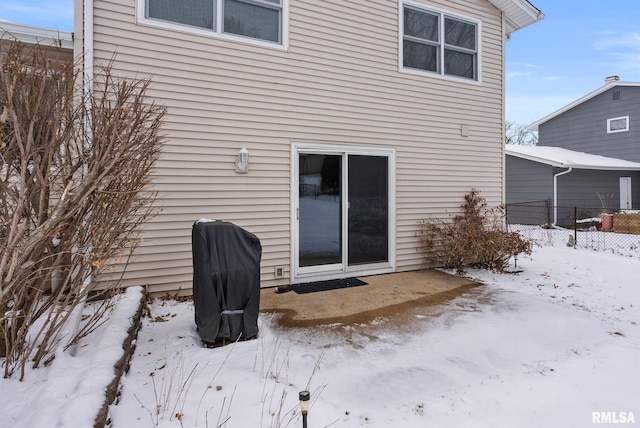 view of snow covered property