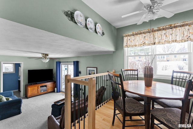 dining area with light wood-type flooring and ceiling fan