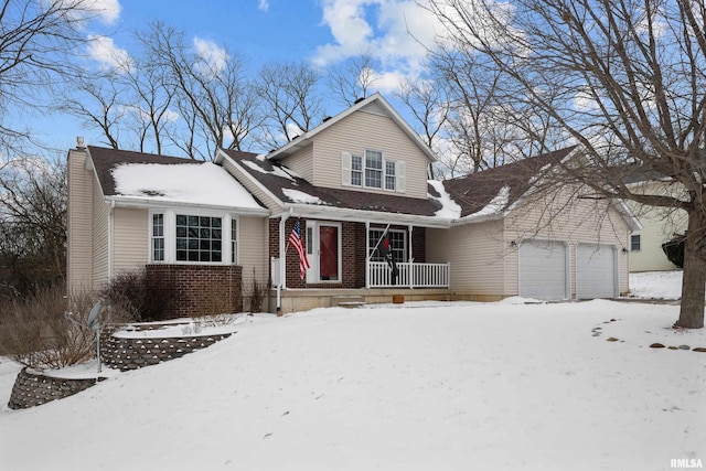 view of front of house featuring a garage and covered porch