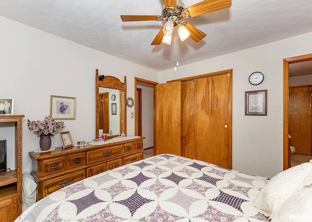 bedroom featuring ceiling fan and a closet