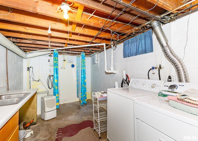 clothes washing area with independent washer and dryer