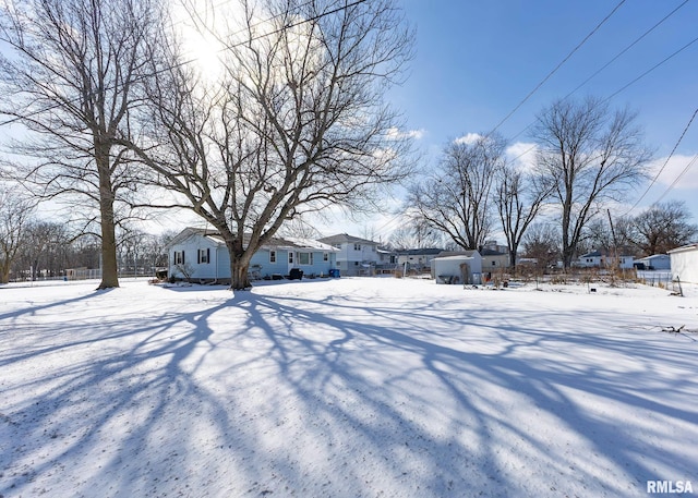 view of yard covered in snow