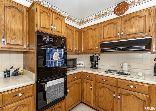 kitchen with double oven, backsplash, and light tile patterned floors