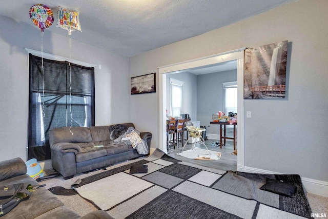 living room with a textured ceiling