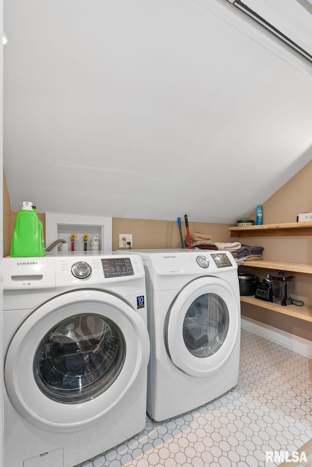 laundry area with washing machine and clothes dryer