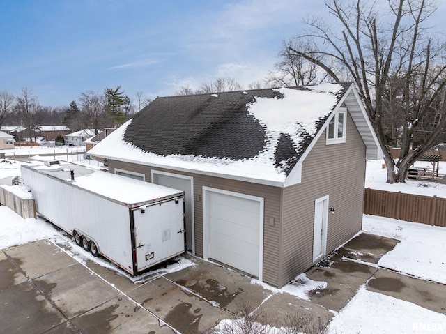 exterior space featuring a garage and an outdoor structure