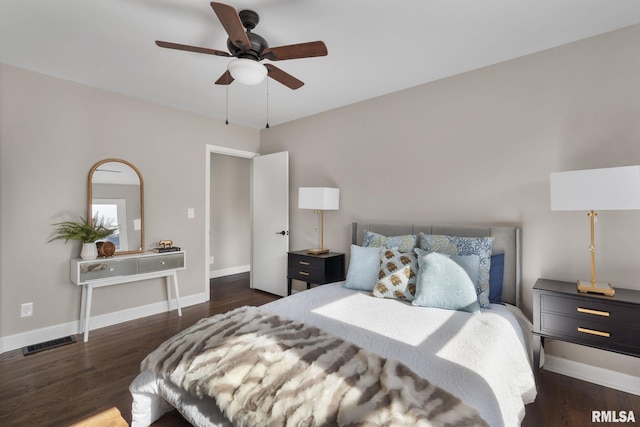 bedroom featuring dark hardwood / wood-style flooring and ceiling fan