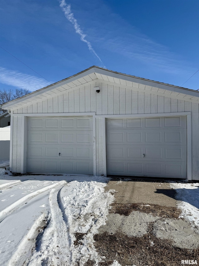 view of snow covered garage