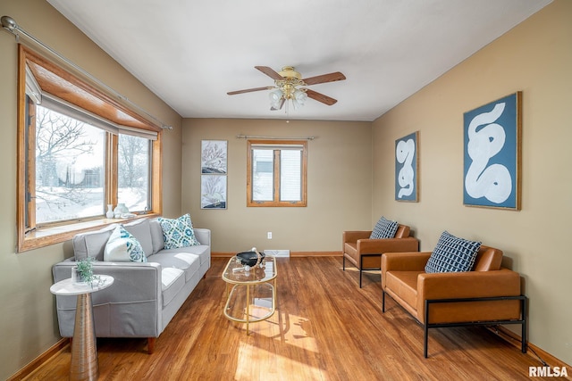 living room featuring hardwood / wood-style floors, a wealth of natural light, and ceiling fan