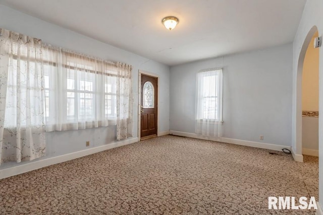 foyer featuring carpet