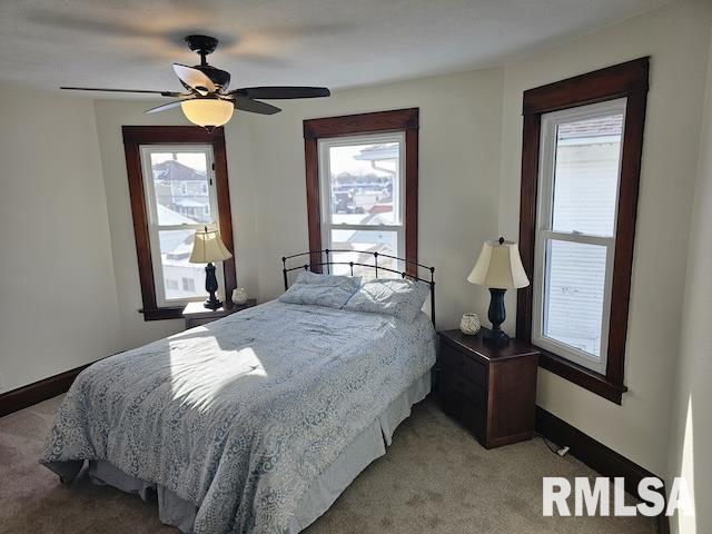 bedroom featuring ceiling fan and light colored carpet