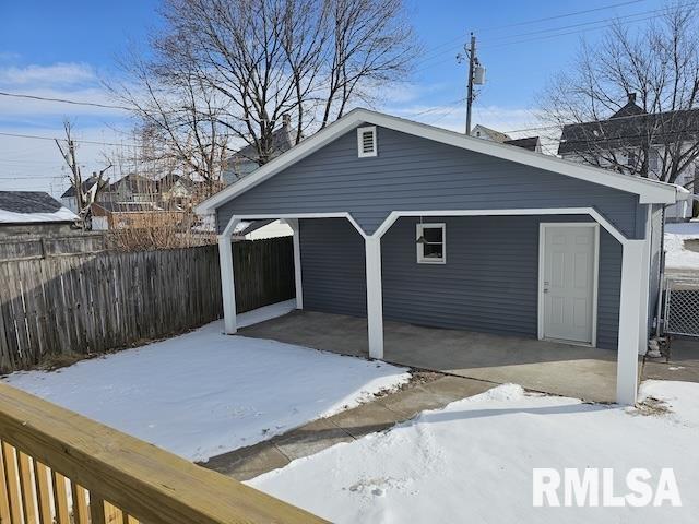 view of snow covered garage