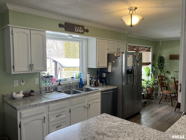 kitchen with sink, black dishwasher, stainless steel fridge with ice dispenser, and white cabinets