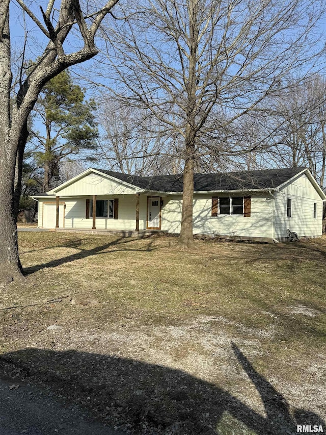 view of front of property with a front yard, a porch, and roof with shingles