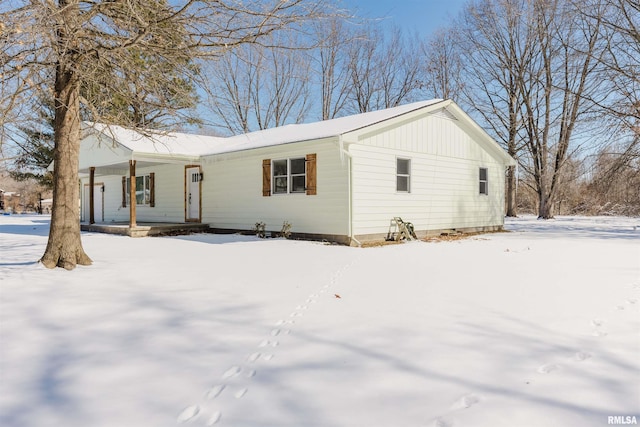 single story home featuring covered porch