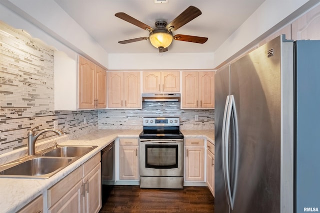 kitchen with sink, light brown cabinetry, stainless steel appliances, and tasteful backsplash