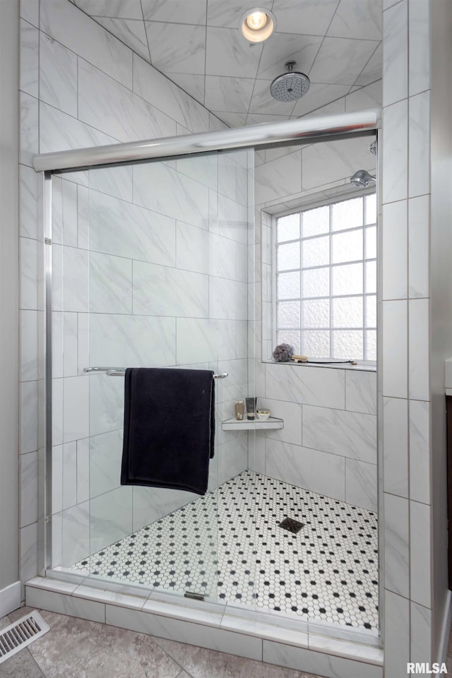 full bath featuring a stall shower and visible vents