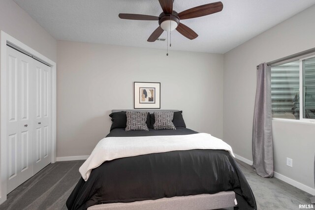 bedroom with carpet, a closet, ceiling fan, and baseboards