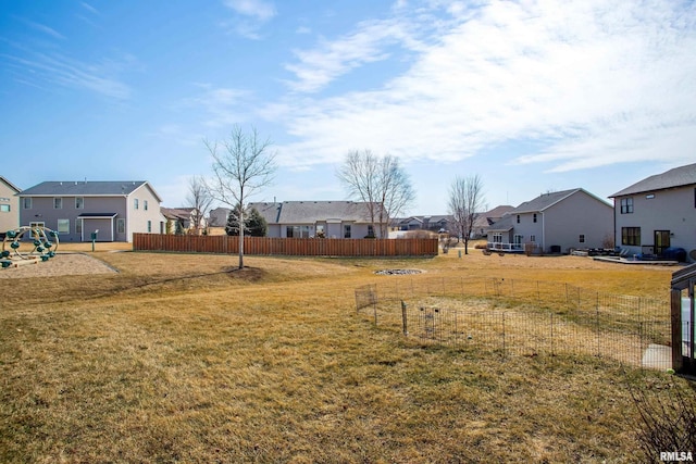 view of yard with fence and a residential view