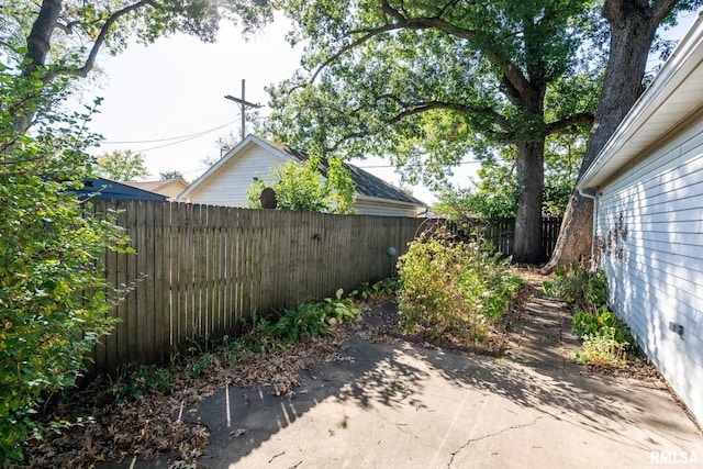 view of yard with a patio area and a fenced backyard