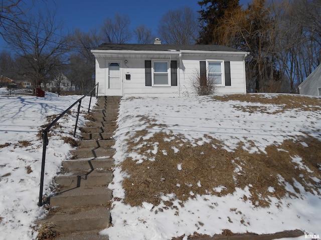 view of front of home with a chimney