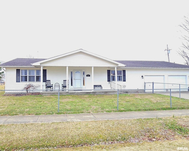 view of front of home featuring a front lawn, covered porch, an attached garage, and concrete driveway