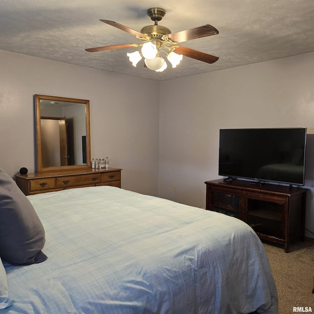 223 N King St, Hurst, IL 62949 - bedroom featuring carpet floors, ceiling fan, and a textured ceiling