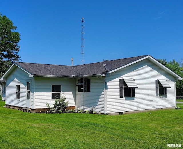 223 N King St, Hurst, IL 62949 - back of property with a lawn, roof with shingles, and crawl space