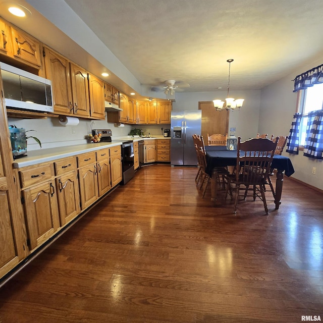223 N King St, Hurst, IL 62949 - kitchen featuring appliances with stainless steel finishes, under cabinet range hood, dark wood finished floors, and recessed lighting