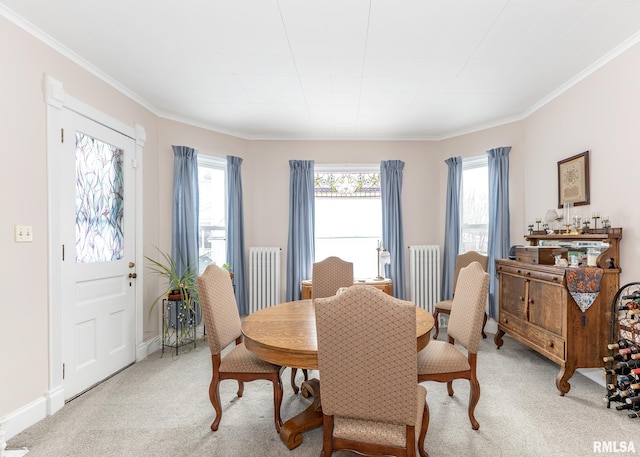 dining room featuring light carpet and crown molding