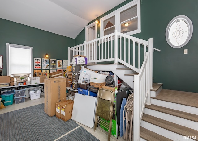 staircase with vaulted ceiling