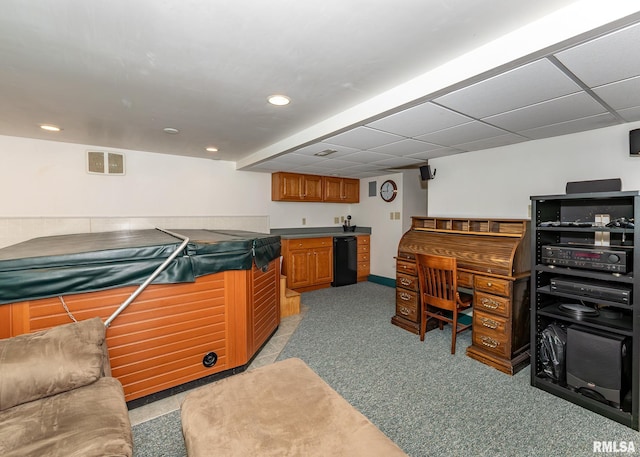 office featuring light colored carpet, recessed lighting, wet bar, and baseboards