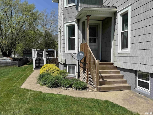 entrance to property with a yard