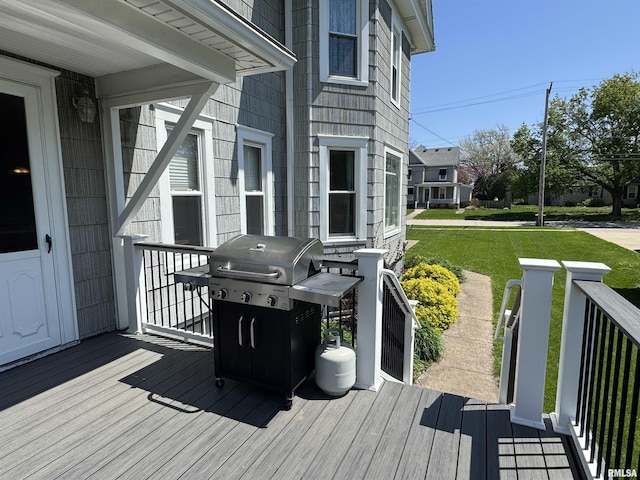 deck featuring area for grilling and a yard