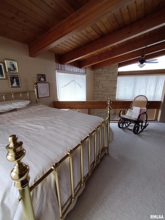 carpeted bedroom featuring beam ceiling and wooden ceiling