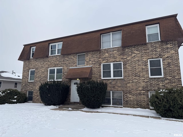 view of front of property featuring brick siding