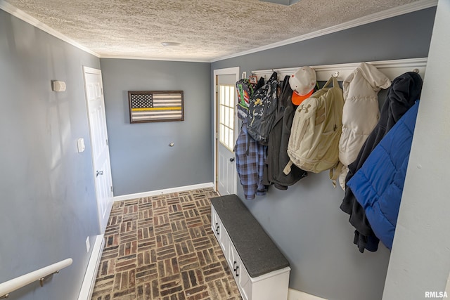 mudroom with crown molding, a textured ceiling, brick floor, and baseboards