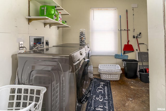 laundry room with washer and dryer and laundry area