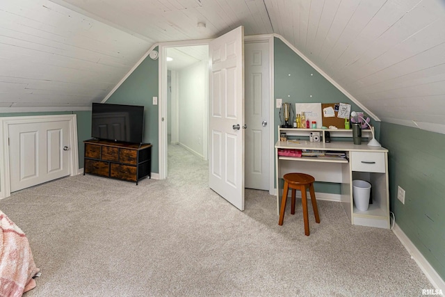 home office featuring lofted ceiling, wooden ceiling, light carpet, and baseboards