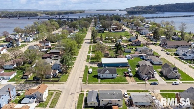 birds eye view of property featuring a water view and a residential view