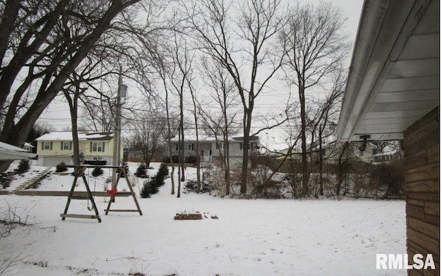 view of yard layered in snow