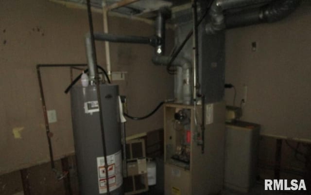 utility room featuring water heater