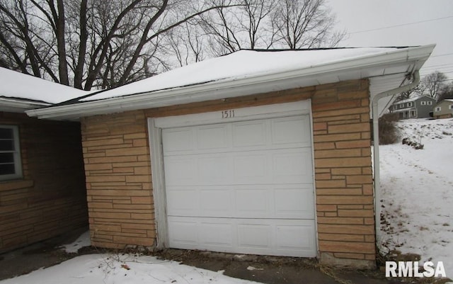 view of snow covered garage